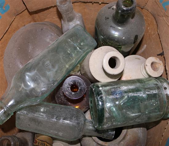 A collection of assorted glass and pottery bottles
